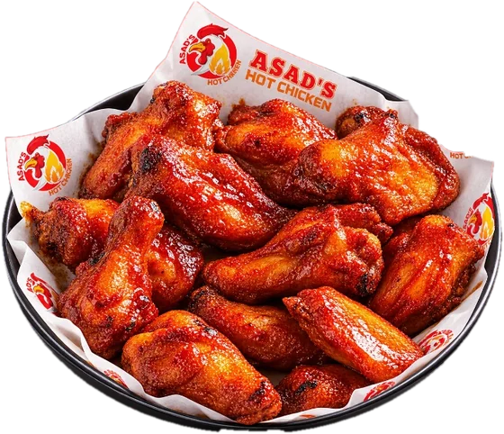 Bowl of sauced chicken wings on Asad's Hot Chicken branded paper